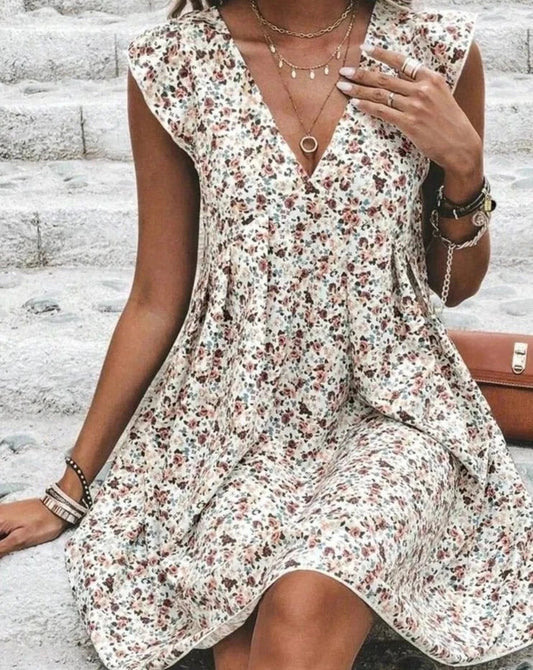 Rayne | הרם את הסגנון שלך עם השמלה הפרחונית התוססת שלנו